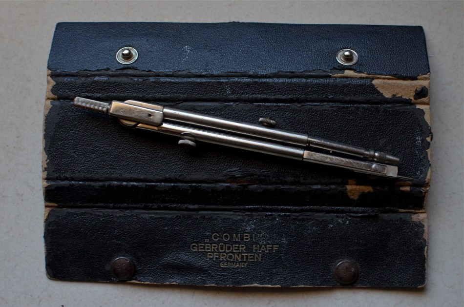 The Things They Carried. My wife's father's leather instrument case and compass. 1/60 sec., f/5.6, ISO 250, 35mm.
