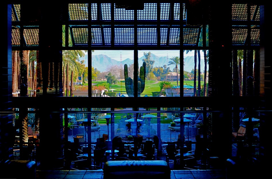 The idea of this image is to highlight what lies beyond the window framing, not the objects in front of it. Lighting should serve that end.