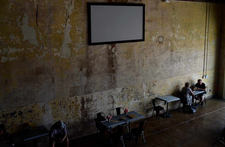 As light "decays" down the wall from right to left, it reveals tiny variances in color.