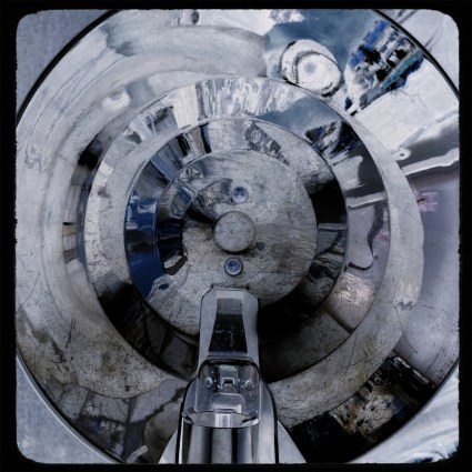 Mobile phone close-up of an antique camera flash pan, negatized in post-editing.