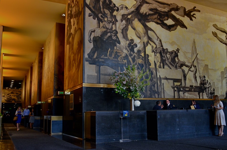 Soaring mural above the main information desk just inside the entrance to 30 Rockefeller Plaza.