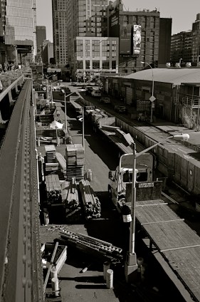 In the portrait-oriented original, extra buildings and street space dilute the impact of the cropped square.