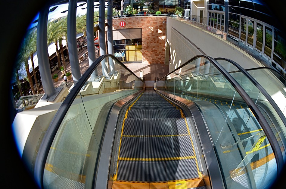 This mall escalator is nowhere near as high as a 13mm fisheye lens makes it appear.