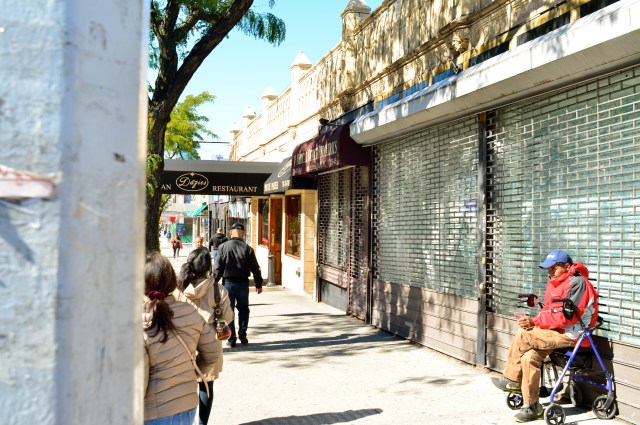 Original DSLR shot with too much color, too much information, and no effective way to isolate the seated man within the frame.